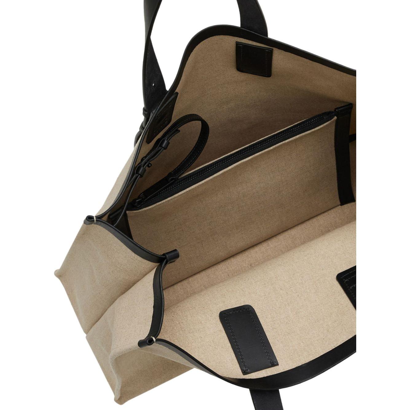 Front view with bag zipped and handles upright.